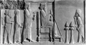 Bas-relief from Persepolis shows Darius I, the Great (seated), followed by his son, crown-prince Xerxes I.